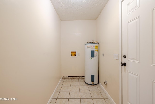 215 Tates Ln, Southport, FL 32409 - washroom with water heater, a textured ceiling, laundry area, light tile patterned floors, and washer hookup