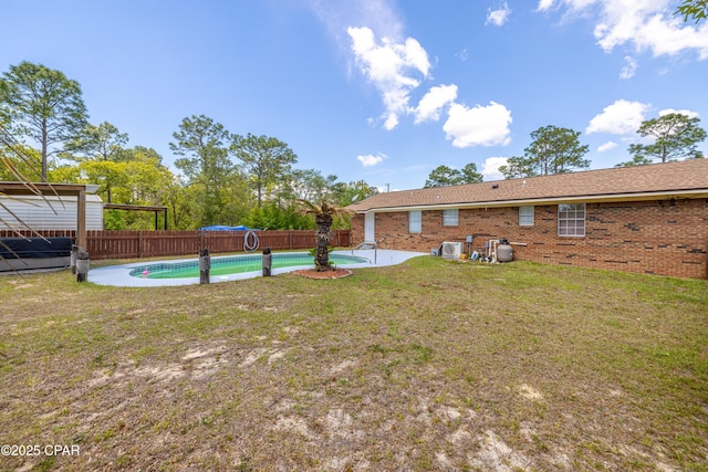 215 Tates Ln, Southport, FL 32409 - view of yard with a patio area, a fenced in pool, and a fenced backyard