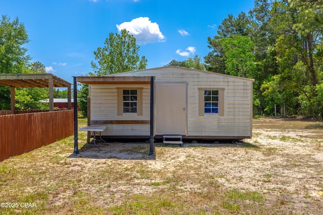 215 Tates Ln, Southport, FL 32409 - view of outdoor structure with an outbuilding and fence