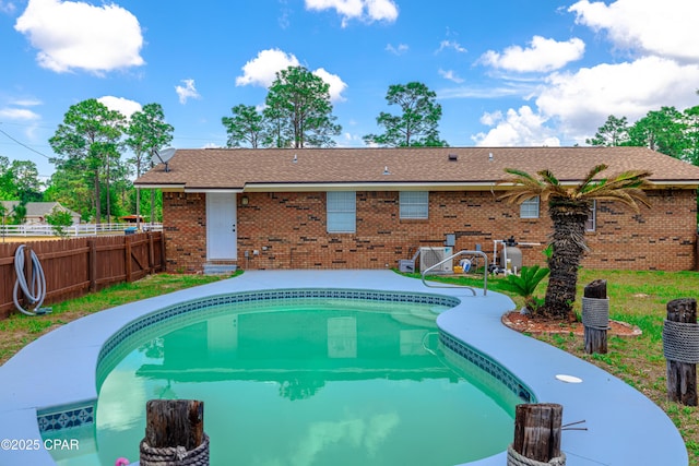 215 Tates Ln, Southport, FL 32409 - view of pool featuring central AC, a patio area, a fenced in pool, and fence