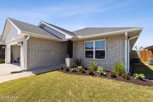 4717 Maegans Ridge Rd, Panama City, FL 32404 - ranch-style home featuring a garage, fence, a front yard, brick siding, and driveway