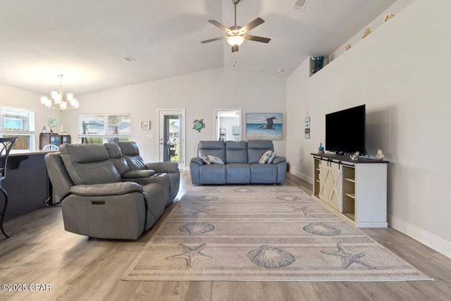 4717 Maegans Ridge Rd, Panama City, FL 32404 - living area with baseboards, visible vents, ceiling fan with notable chandelier, vaulted ceiling, and wood finished floors