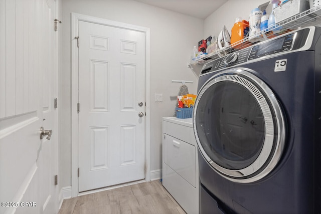 4717 Maegans Ridge Rd, Panama City, FL 32404 - laundry room with laundry area, light wood-type flooring, and washing machine and dryer