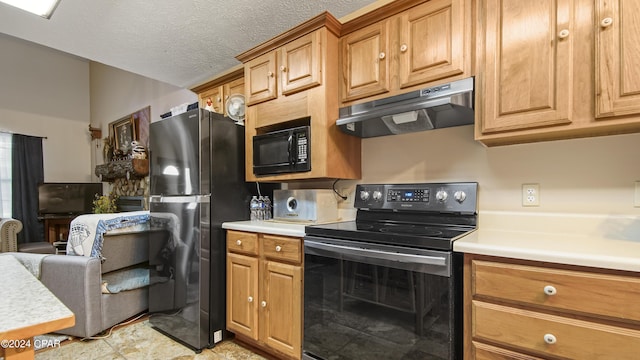kitchen with under cabinet range hood, light countertops, brown cabinets, and black appliances