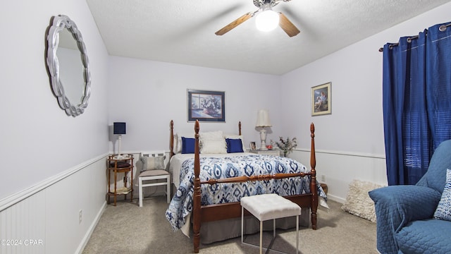 carpeted bedroom featuring a ceiling fan and baseboards