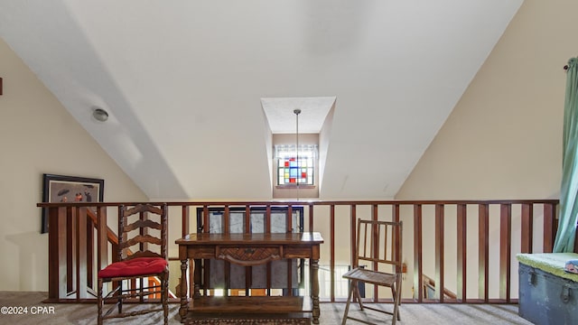 staircase featuring carpet and lofted ceiling