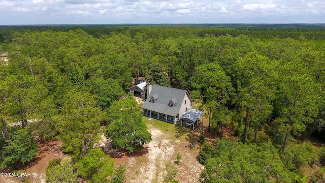 birds eye view of property with a forest view