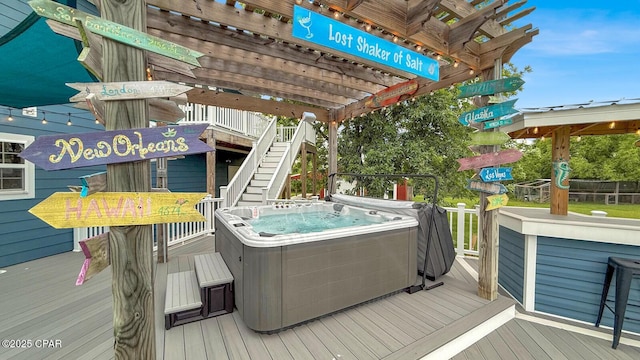8508 S Holland Rd, Southport, FL 32409 - wooden deck with a hot tub and stairway