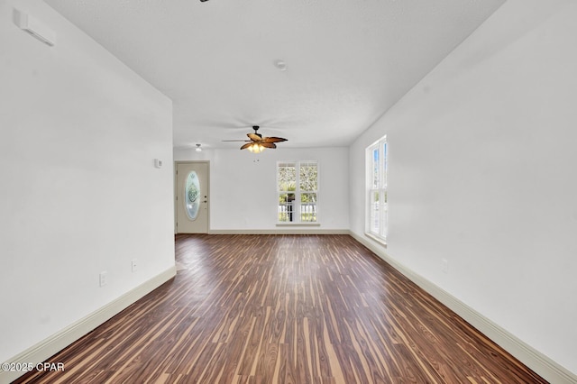 8508 S Holland Rd, Southport, FL 32409 - unfurnished room featuring ceiling fan, wood finished floors, and baseboards