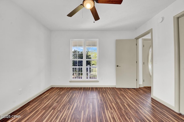 8508 S Holland Rd, Southport, FL 32409 - unfurnished room with wood finished floors, ceiling fan, baseboards, and a smoke detector