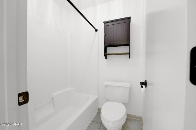 8508 S Holland Rd, Southport, FL 32409 - bathroom with toilet, baseboards, bathing tub / shower combination, and tile patterned flooring