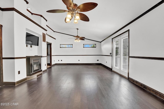 8508 S Holland Rd, Southport, FL 32409 - unfurnished living room with a ceiling fan, wood finished floors, lofted ceiling, ornamental molding, and a glass covered fireplace