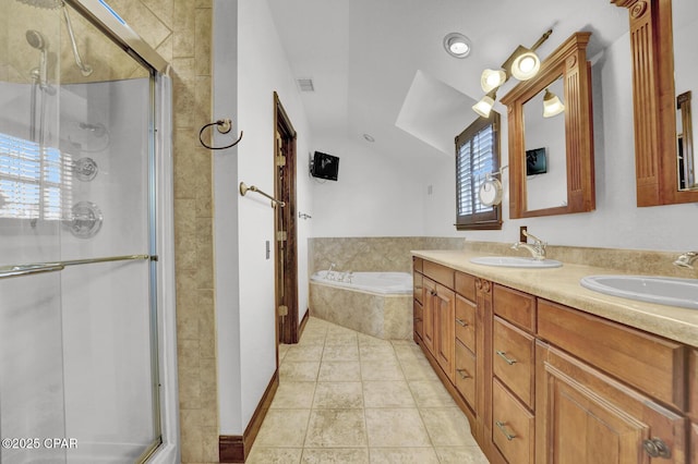 8508 S Holland Rd, Southport, FL 32409 - full bathroom featuring a stall shower, a bath, double vanity, vaulted ceiling, and tile patterned floors