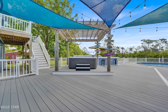 8508 S Holland Rd, Southport, FL 32409 - wooden terrace with a hot tub, stairs, and a pergola