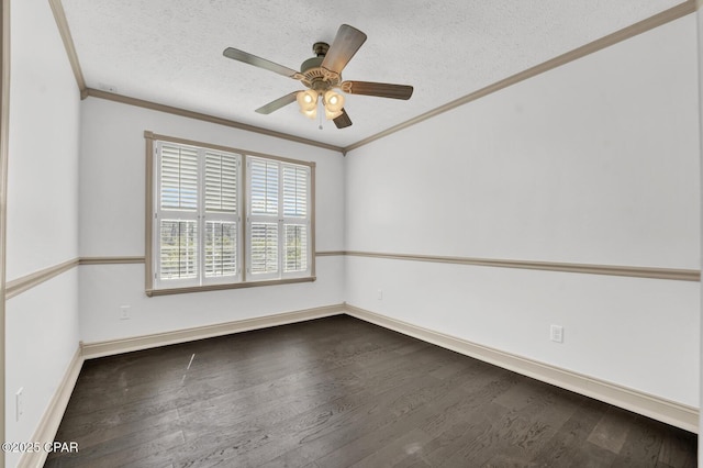 8508 S Holland Rd, Southport, FL 32409 - spare room featuring ornamental molding, a textured ceiling, dark wood finished floors, baseboards, and a ceiling fan