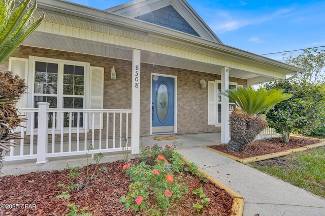 8508 S Holland Rd, Southport, FL 32409 - entrance to property featuring brick siding and a porch