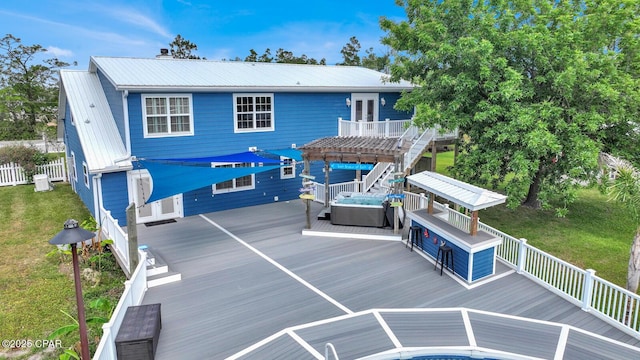 8508 S Holland Rd, Southport, FL 32409 - back of property with a deck, metal roof, a pergola, and a yard