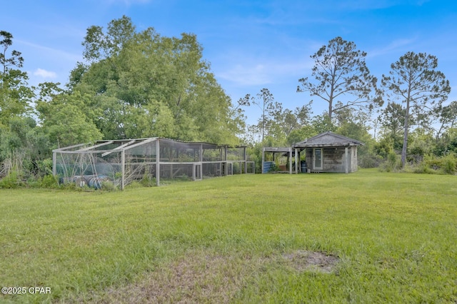 8508 S Holland Rd, Southport, FL 32409 - view of green lawn featuring an outdoor structure