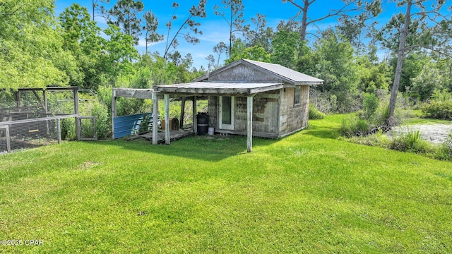 8508 S Holland Rd, Southport, FL 32409 - view of grassy yard with an outdoor structure