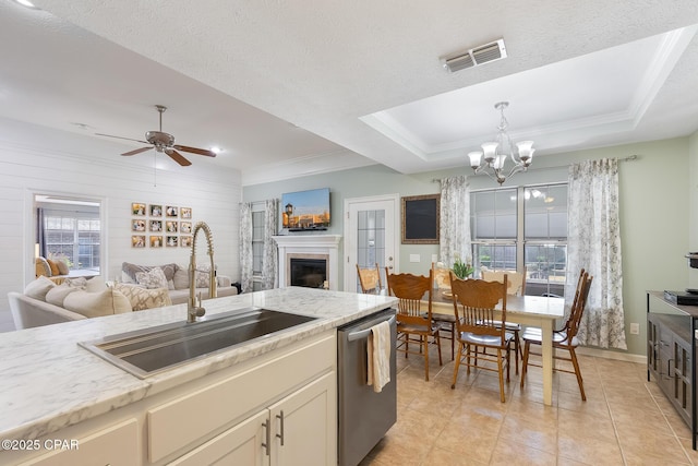 3543 Brentwood Pl, Panama City, FL 32404 - kitchen featuring a sink, stainless steel dishwasher, a chandelier, ceiling fan, and a fireplace
