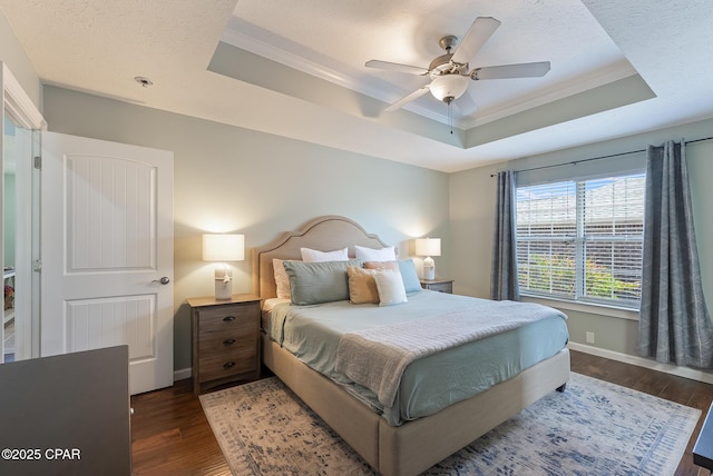 3543 Brentwood Pl, Panama City, FL 32404 - bedroom with a raised ceiling, ornamental molding, wood finished floors, a textured ceiling, and baseboards