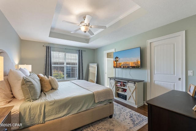 3543 Brentwood Pl, Panama City, FL 32404 - bedroom with a raised ceiling, dark wood-type flooring, and ceiling fan