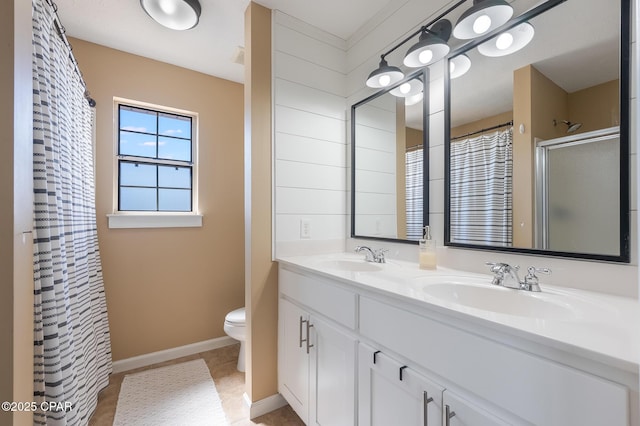3543 Brentwood Pl, Panama City, FL 32404 - bathroom featuring toilet, double vanity, a shower with shower curtain, baseboards, and tile patterned flooring