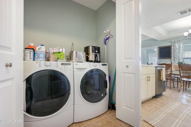 3543 Brentwood Pl, Panama City, FL 32404 - washroom featuring washer and clothes dryer, light tile patterned floors, and ornamental molding