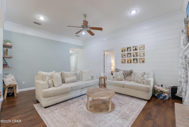 3543 Brentwood Pl, Panama City, FL 32404 - living room with a ceiling fan, dark wood-type flooring, crown molding, baseboards, and wood walls
