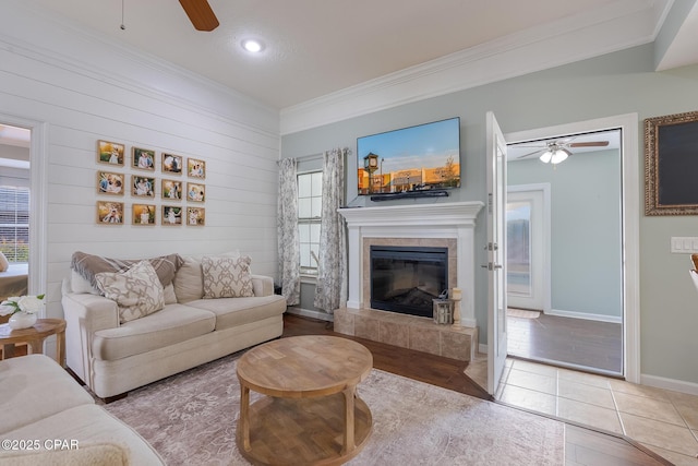 3543 Brentwood Pl, Panama City, FL 32404 - living area featuring a ceiling fan, ornamental molding, a tiled fireplace, recessed lighting, and wood finished floors