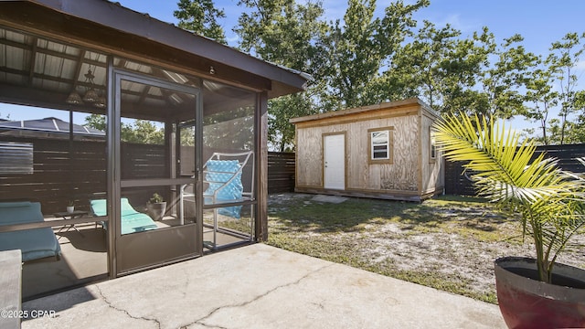 722 E Pine Forest Dr, Lynn Haven, FL 32444 - view of patio / terrace with a sunroom, a shed, fence, and an outdoor structure