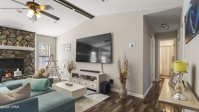 722 E Pine Forest Dr, Lynn Haven, FL 32444 - living area featuring a ceiling fan, dark wood-style flooring, baseboards, and a stone fireplace
