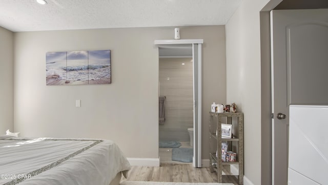 722 E Pine Forest Dr, Lynn Haven, FL 32444 - bedroom with wood finished floors, a textured ceiling, baseboards, and recessed lighting