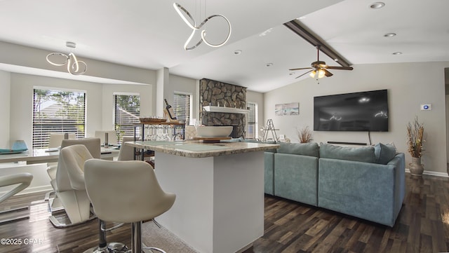 722 E Pine Forest Dr, Lynn Haven, FL 32444 - kitchen with dark wood finished floors, a fireplace, recessed lighting, decorative light fixtures, and a ceiling fan