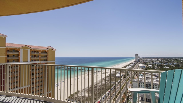 balcony with view of water and beach