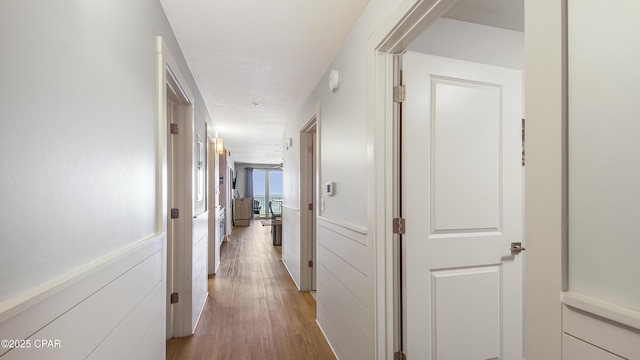 hall with light wood-style floors