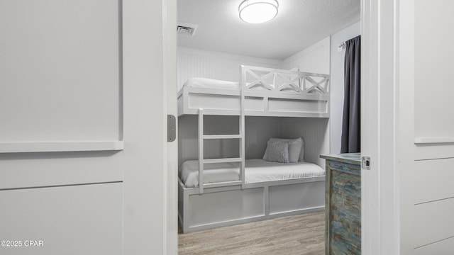bedroom with wood finished floors