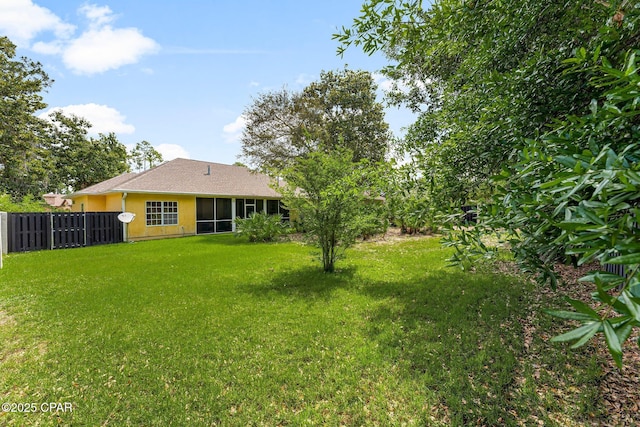 view of yard with a sunroom