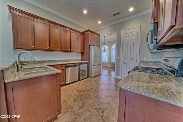 kitchen featuring a sink, stainless steel appliances, crown molding, light stone countertops, and wine cooler