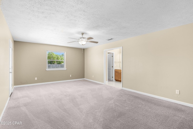 7936 Betty Louise Dr, Panama City, FL 32404 - empty room featuring a ceiling fan, light colored carpet, baseboards, and a textured ceiling