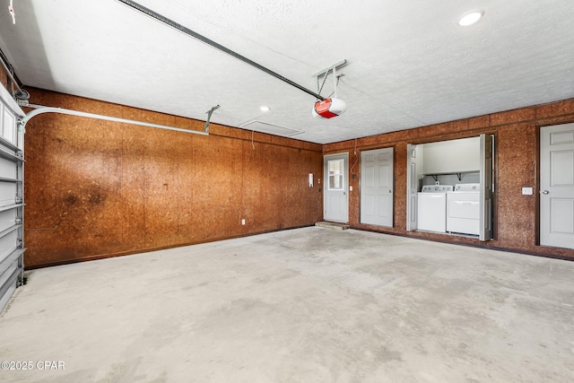7936 Betty Louise Dr, Panama City, FL 32404 - garage with washing machine and clothes dryer, a garage door opener, and recessed lighting
