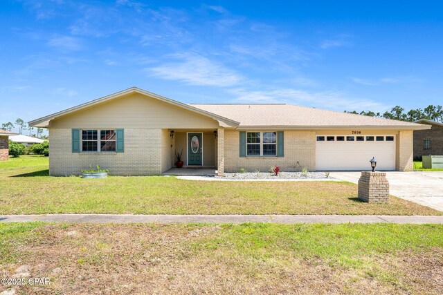 7936 Betty Louise Dr, Panama City, FL 32404 - single story home featuring brick siding, concrete driveway, an attached garage, and a front lawn