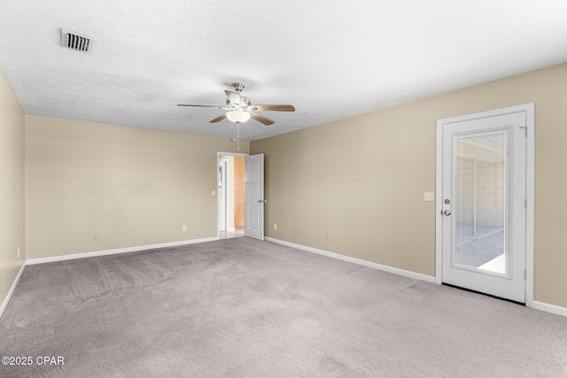 7936 Betty Louise Dr, Panama City, FL 32404 - spare room featuring a ceiling fan, carpet flooring, baseboards, and a textured ceiling