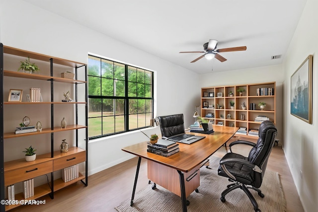 10367 NW County Road 274, Altha, FL 32421 - home office featuring a ceiling fan, wood finished floors, and baseboards