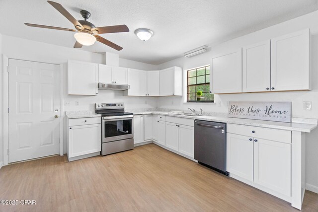 10367 NW County Road 274, Altha, FL 32421 - kitchen featuring stainless steel appliances, under cabinet range hood, light countertops, a ceiling fan, and white cabinets