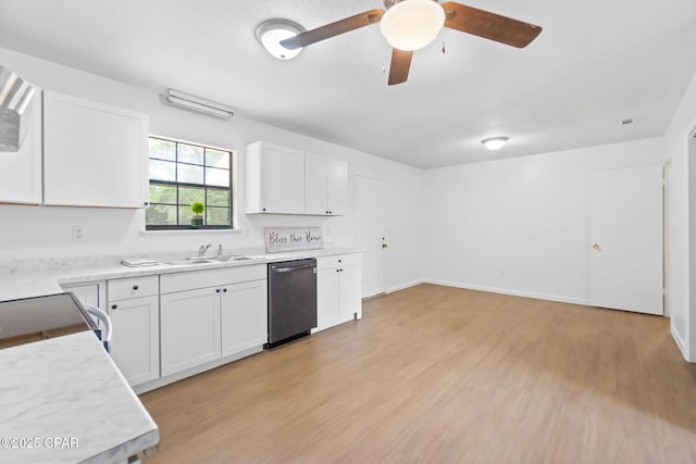 10367 NW County Road 274, Altha, FL 32421 - kitchen featuring dishwashing machine, a sink, white cabinetry, ceiling fan, and light countertops
