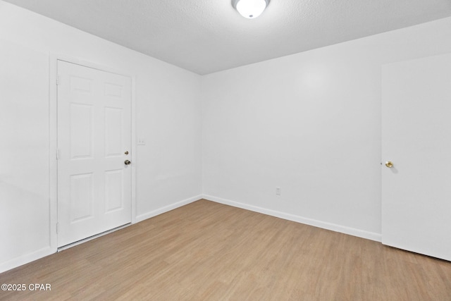 10367 NW County Road 274, Altha, FL 32421 - spare room featuring wood finished floors and baseboards
