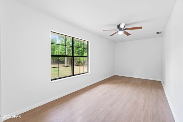 10367 NW County Road 274, Altha, FL 32421 - unfurnished room featuring wood finished floors, a ceiling fan, and baseboards