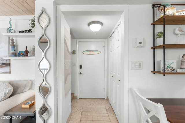 entryway featuring light tile patterned floors