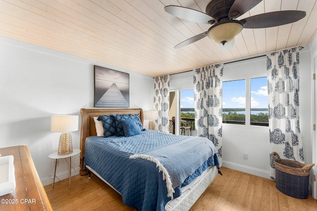 bedroom with wooden ceiling, baseboards, hardwood / wood-style flooring, and a ceiling fan
